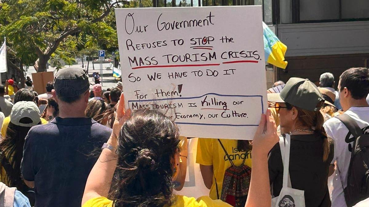 Holidaymakers too scared to leave their rooms as thousands of anti-tourism protesters have taken to the streets of the Canary Islands