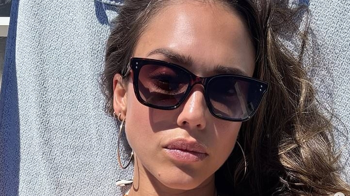 Jessica Alba shows off her svelte figure in tiny bikini as she enjoys sun-soaked beach day during Cannes Film Festival - after her reunion with estranged husband Cash Warren