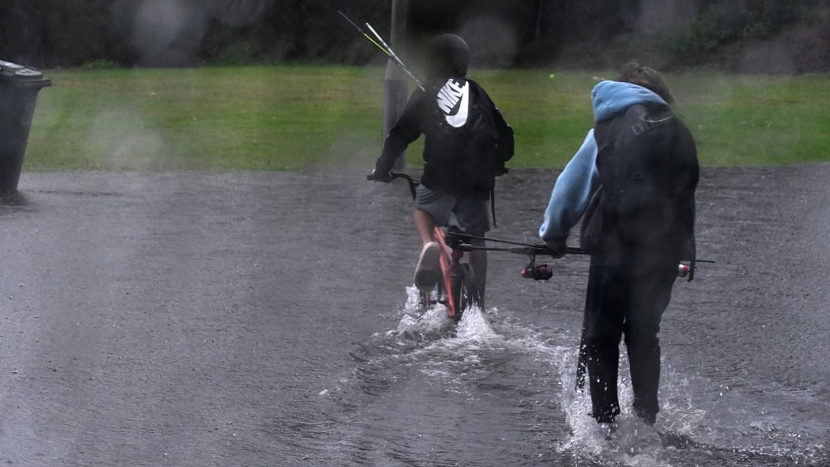 Almost 30 schools on Australia's east coast are forced to close as massive rain bomb sparks severe floods - and the wild weather is set to last all week