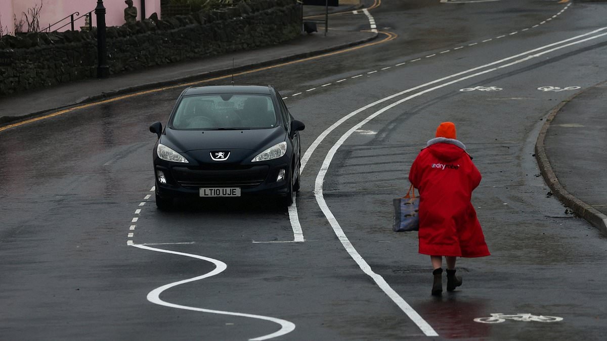 Britain's daftest road markings are finally removed after council spent £1.5m on wiggly lines that left drivers and cyclists baffled