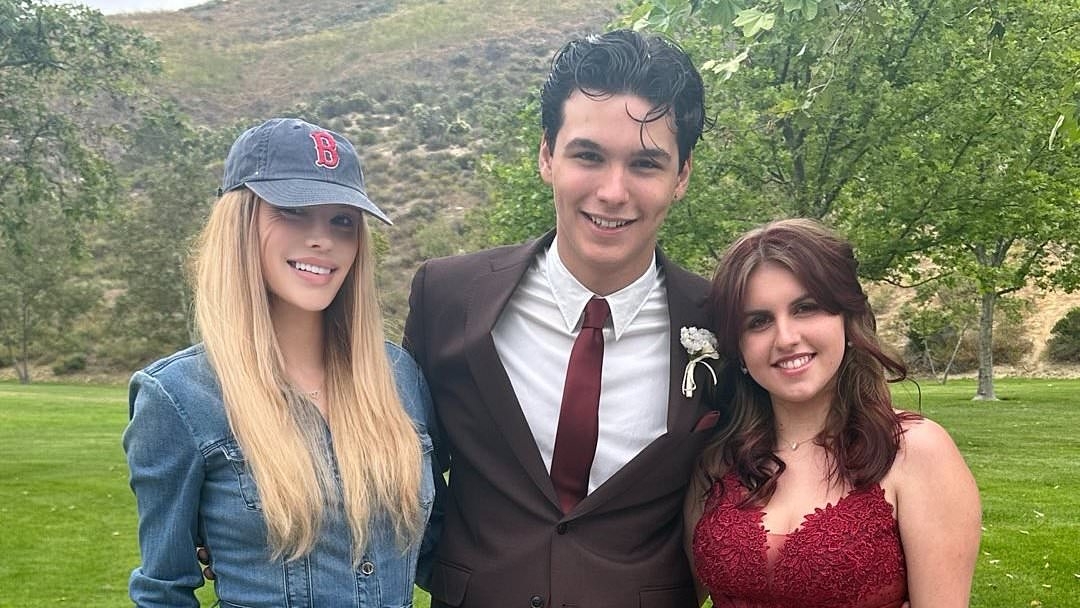 Brandi Glanville's son towers over her as he goes to prom while she uses a filter to smooth out facial disfigurement