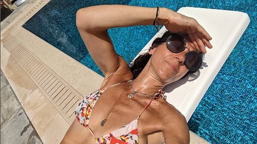 Julia Bradbury shares throwback bikini snaps from 'carefree' summer holiday prior to her breast cancer diagnosis: 'I thought I had nothing to worry about'