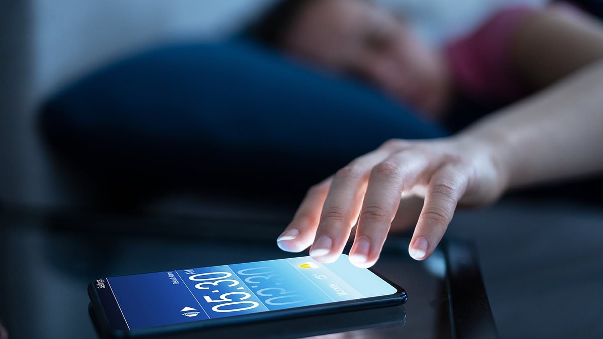 Hitting the snooze button can disrupt key sleep stages and make you groggier, say experts