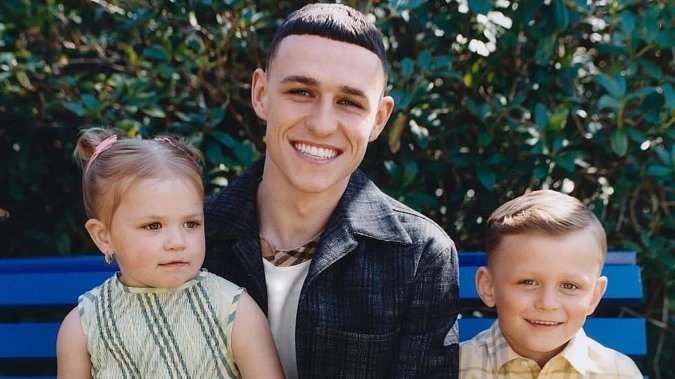 Phil Foden is every inch the doting dad as he poses with his two eldest kids in adorable Father's Day photoshoot - becoming latest England footballer to star in a Burberry campaign