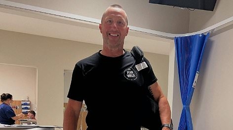 Footy legend takes his first steps after having life-changing surgery to fix damage from his 210-game career