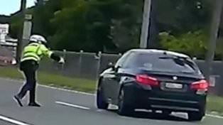 Wild moment cranky cop hurls a speed radar at a P-plater driver's car
