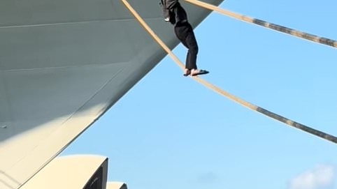 Shocking moment man tries to climb onto cruise ship using mooring ropes and is arrested