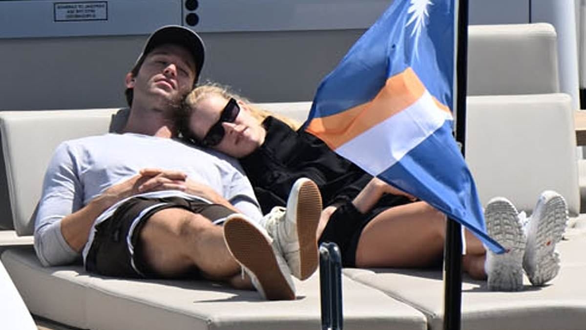 Patrick Schwarzenegger packs on PDA with stunning fiancée Abby Champion as loved-up couple cosy up together onboard boat in French Riviera