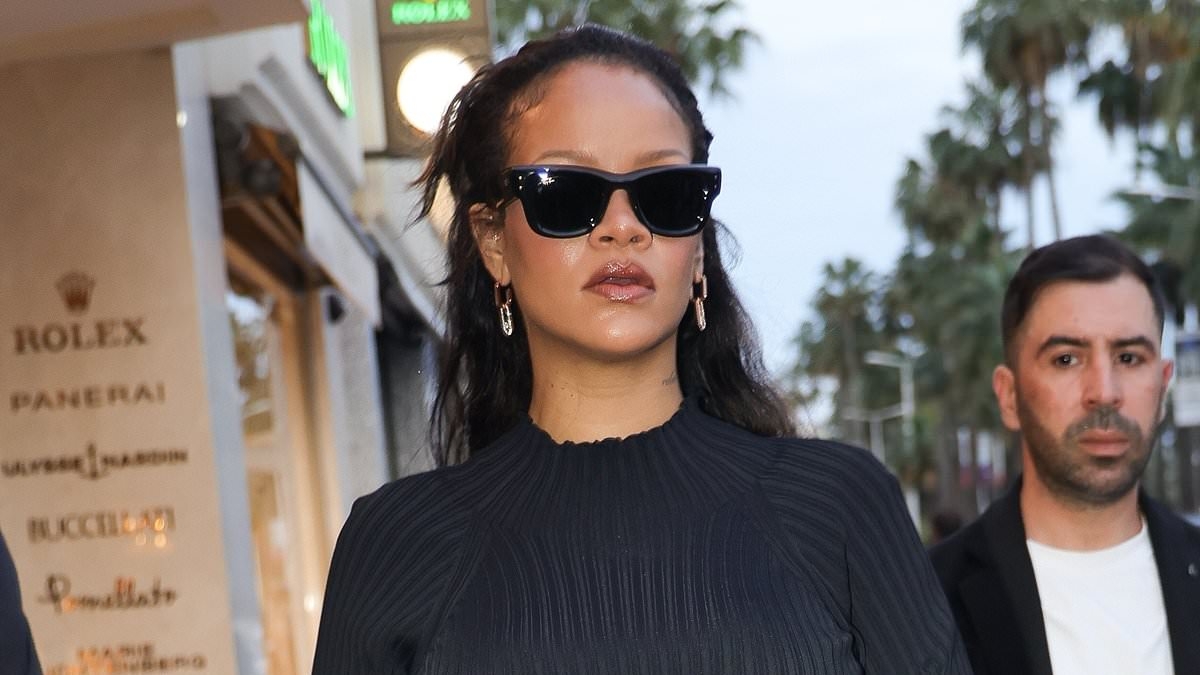 Pregnant Rihanna cradles her baby bump in a stylish fringed dress as she visits Boutique Messika in Cannes