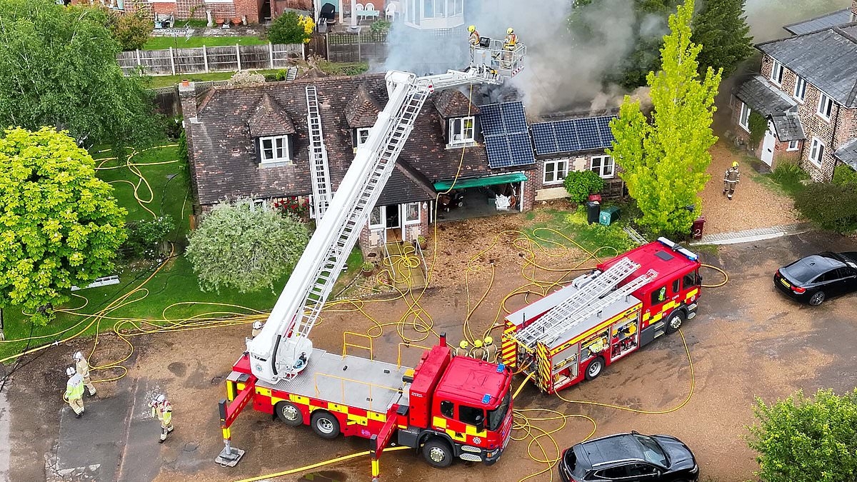 Crews battling house fire caused by LIGHTNING - after Met Office issued a tornado warning