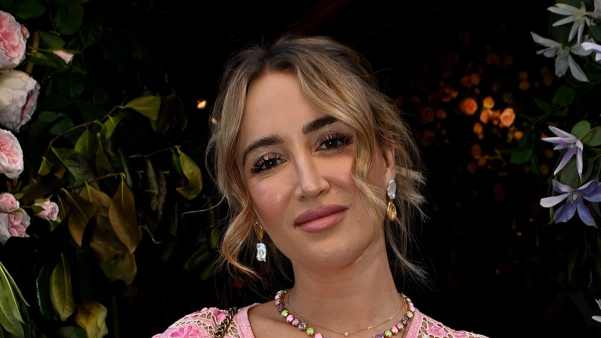 Pregnant Georgia Harrison proudly cradles her blossoming baby bump in a stylish pink dress as she heads to swanky London restaurant