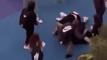Couple is surrounded and bashed by group of teens in alleged racist attack - as the footage goes viral in China