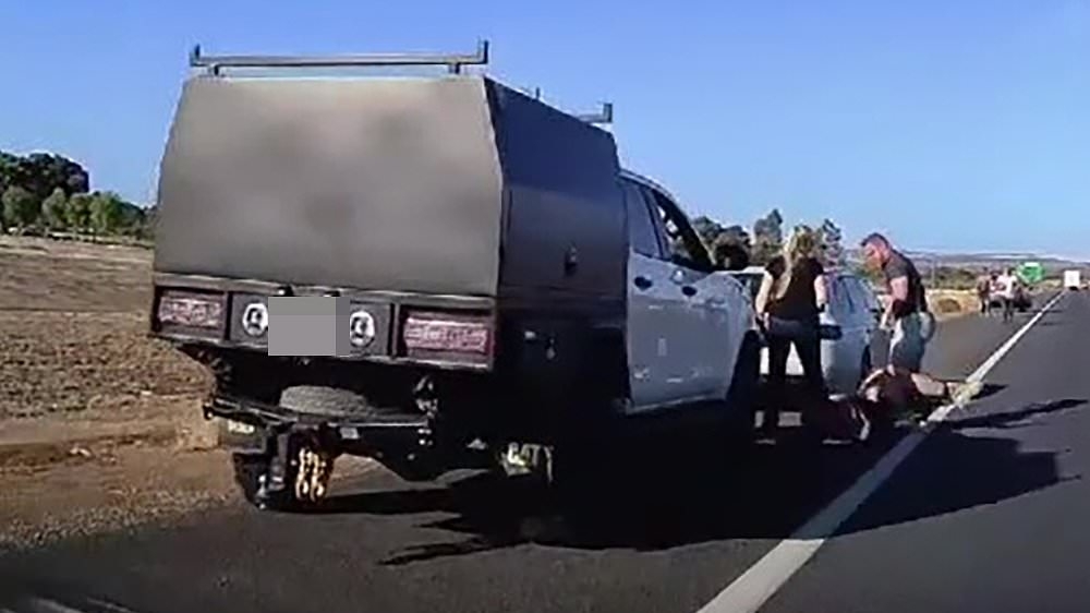 Wild scenes as brutal road rage incident spills in front of oncoming traffic on a busy freeway