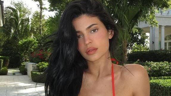Kylie Jenner poses in Claudia Schiffer's identical £10k red Chanel bikini - 30 years after the supermodel walked the runway in it