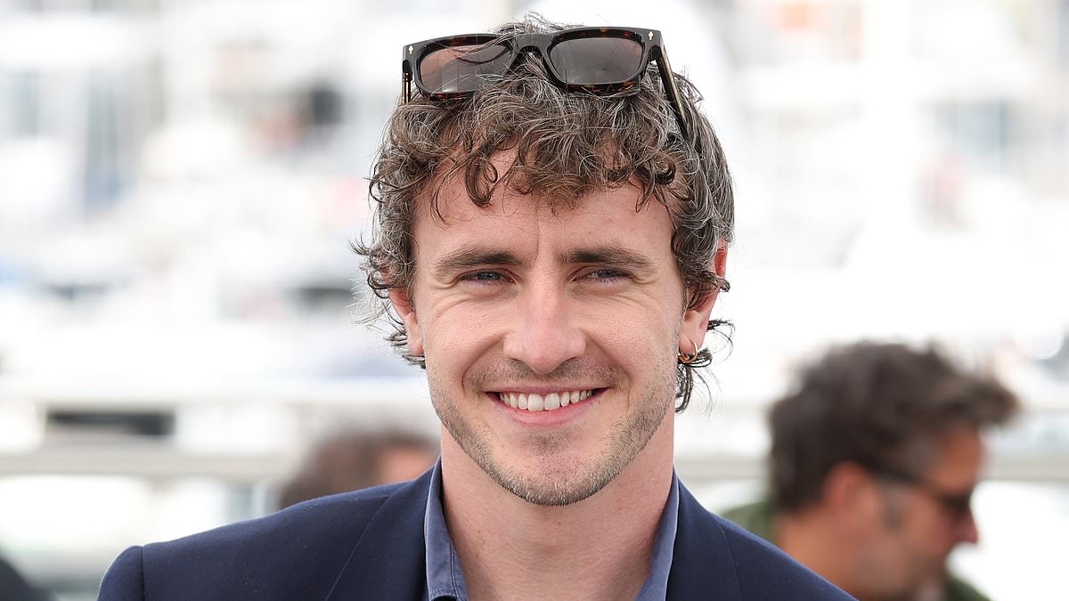 Paul Mescal looks effortlessly stylish in navy suit and denim shirt as he waves to fans at The History Of Sound photocall in Cannes after the 'sexless' gay romance was panned by critics