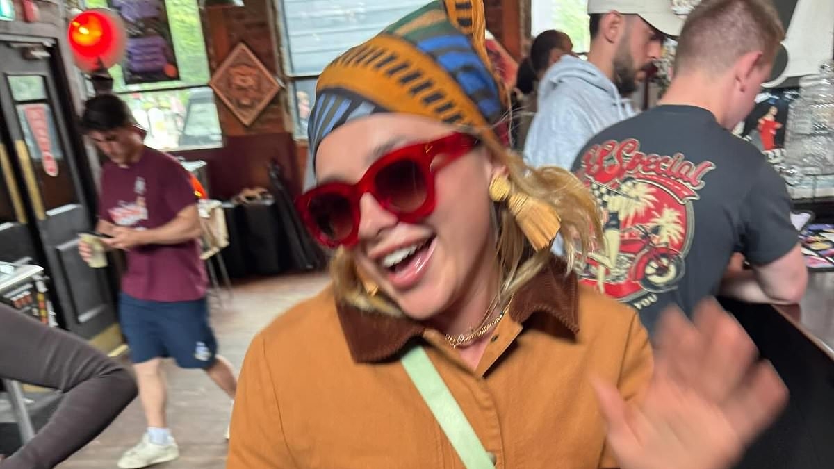 Florence Pugh shares a playful kiss with male pal as she shares fun-filled snaps spending time with her friends in London after winning rave reviews for star turn in Marvel's Thunderbolts*