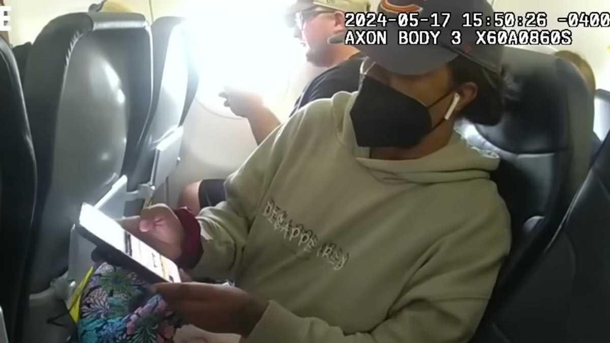 Spirit Airlines 'seat squatter' is escorted off plane by police - but was she in the RIGHT?