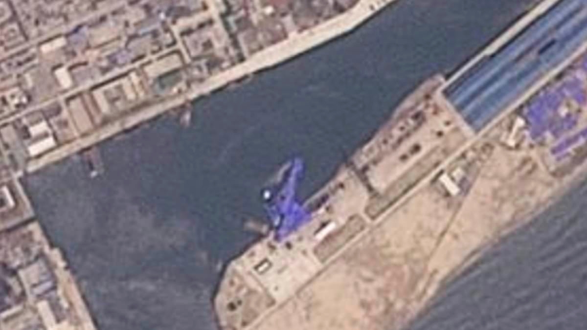 North Korea appears to hide sunken warship under tarpaulins