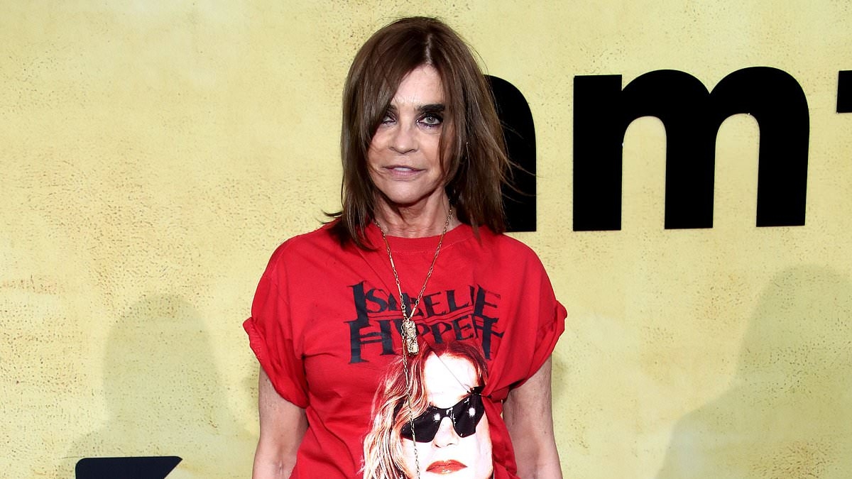 French fashion editor Carine Roitfeld seriously misses the mark as she attends glamorous amfAR gala in Cannes in just a casual T-shirt