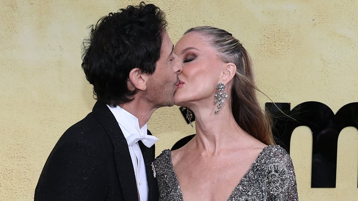 Adrien Brody shares a passionate kiss with glamorous girlfriend Georgina Chapman as they attend Cannes Film Festival's 2025 amfAR Gala