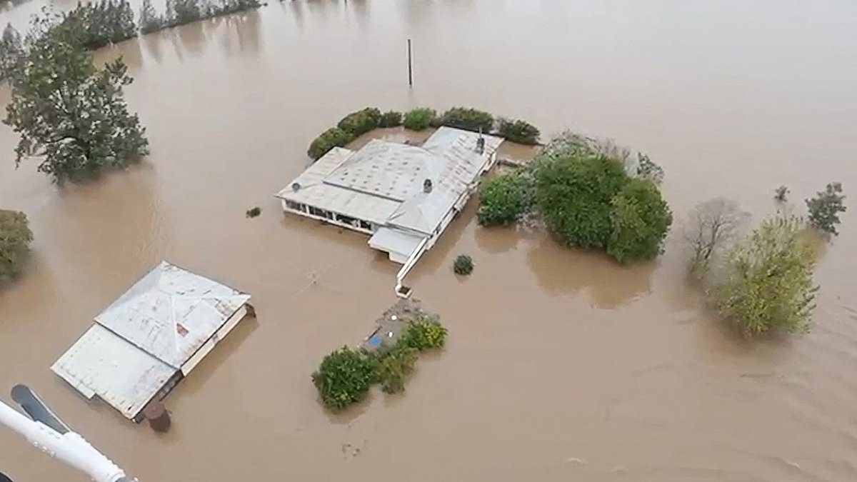 BREAKING NEWS NSW floods death toll rises to five as body is found in burnt-out car and communities remain cutoff