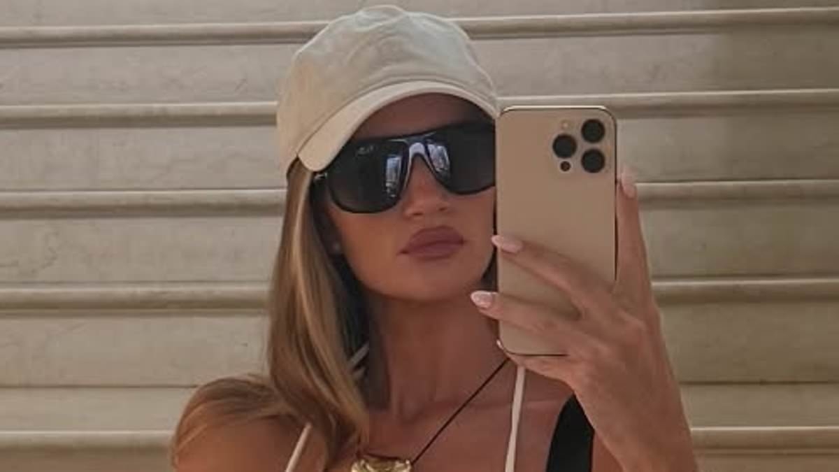 Rosie Huntington-Whiteley flaunts her abs in a white bikini as she enjoys a luxurious getaway in Antibes after Cannes Film Festival