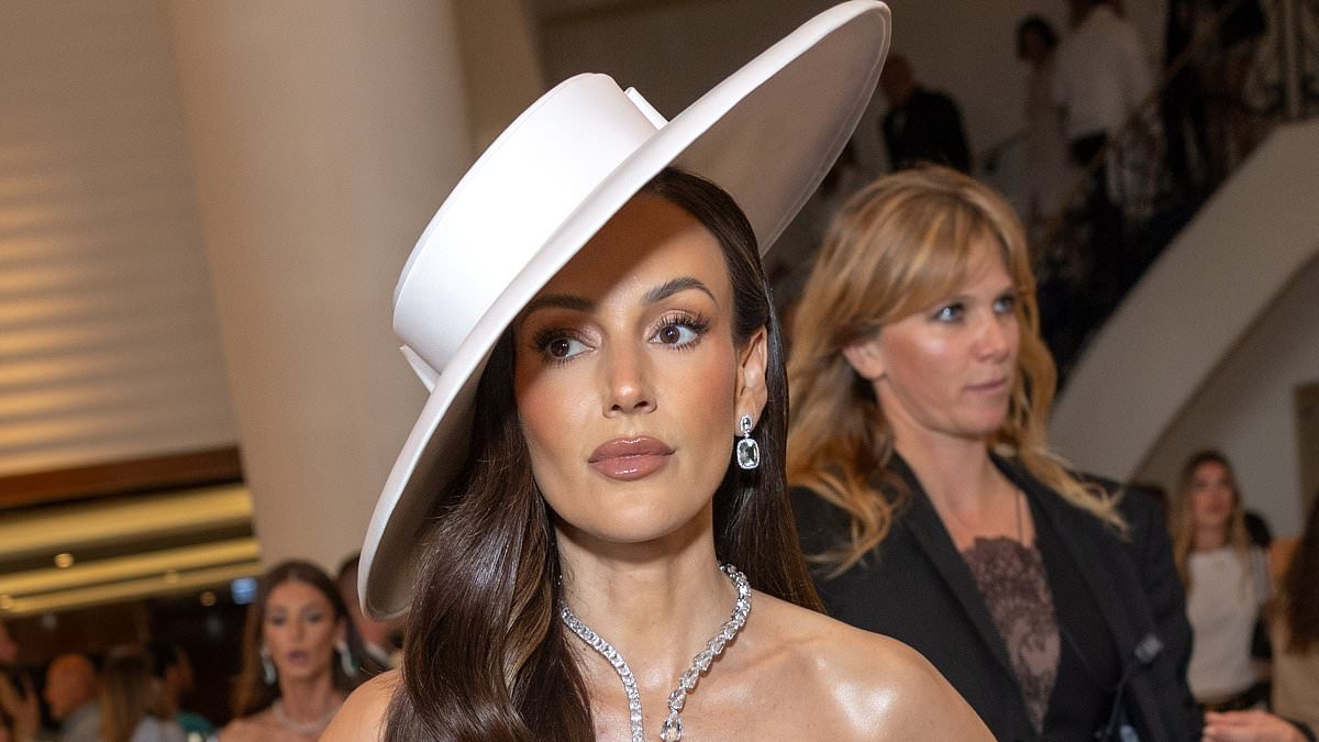 Michelle Keegan puts on a glamorous display in a structured white gown and dramatic hat as she leads the stars in Cannes ahead of L'Oreal Light on Women Award