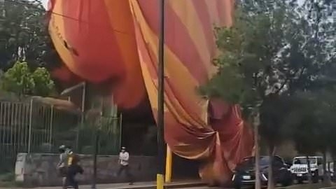Terrifying moment hot air balloon crashes back down to earth near Mexican pyramids - leaving at least 12 injured
