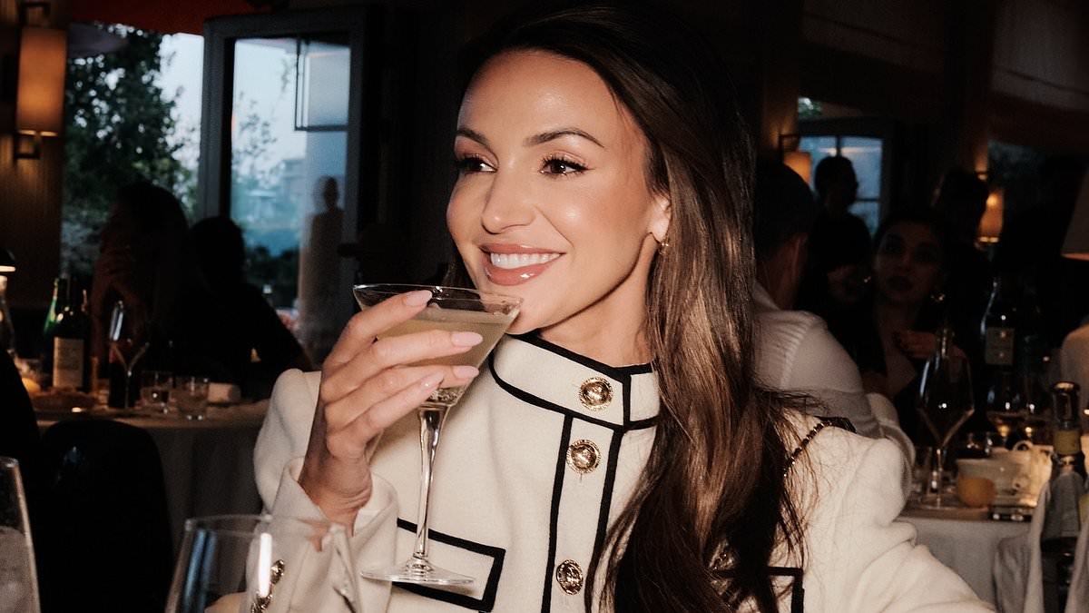 Michelle Keegan looks out of this world in a stylish white and black co-ord as she sips on cocktails in Cannes - two months after giving birth