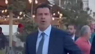 Luis Figo directs X-rated gesture at Barcelona supporter who called him a 'traitor' in tense moment 25 years after controversial move to Real Madrid