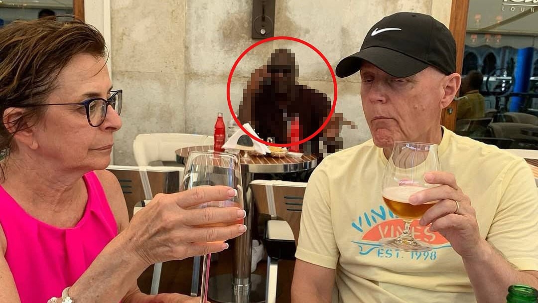 Incredible moment family realize all-time sporting great is casually sitting behind them in vacation photos