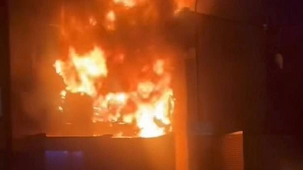 Horrifying images show house fire that killed children aged four, eight and 15 along with woman, 43, as police arrest man