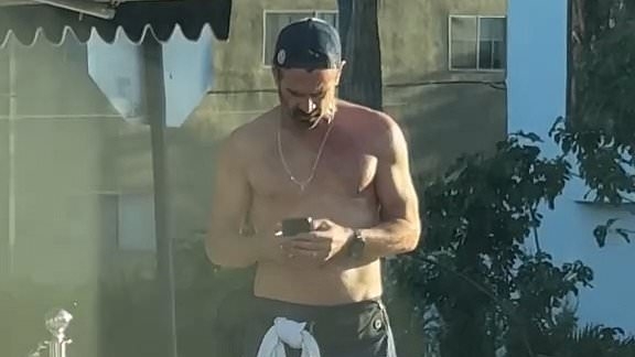 A-List movie star, 48, shocks fans with his chiselled torso as he goes shirtless while grabbing a coffee in LA - can YOU guess who it is?