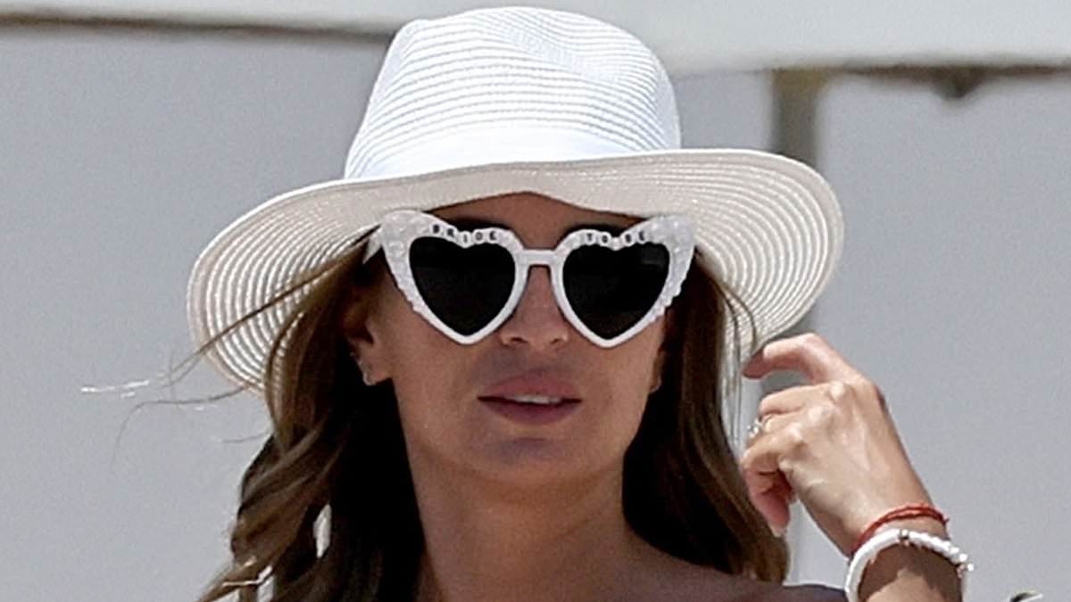 Dani Dyer looks sensational in a white bikini and 'bride-to-be' glasses as she soaks up the sun on her hen do in Ibiza ahead of wedding to West Ham footballer Jarrod Bowen
