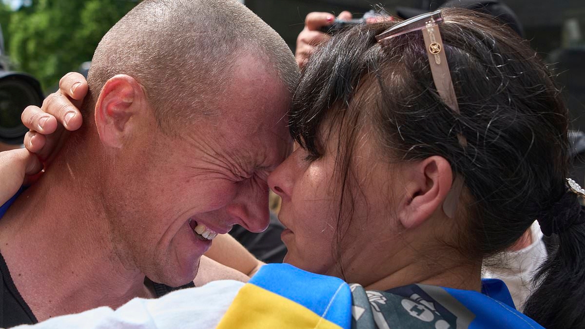 Moment Ukrainian soldier kisses his wife after being freed during Russia and Ukraine's swap of over 300 more prisoners