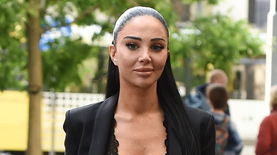 Tulisa puts on a very revealing display as she parties in Manchester days after sharing snaps of her swollen face after multiple beauty treatments