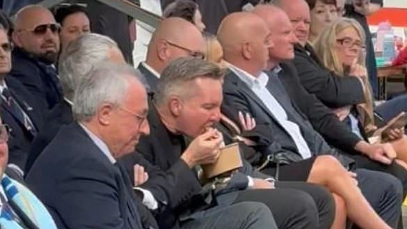 Chris Bowen sparks outrage after he is caught eating pasta at Catholic mass: 'Rude'