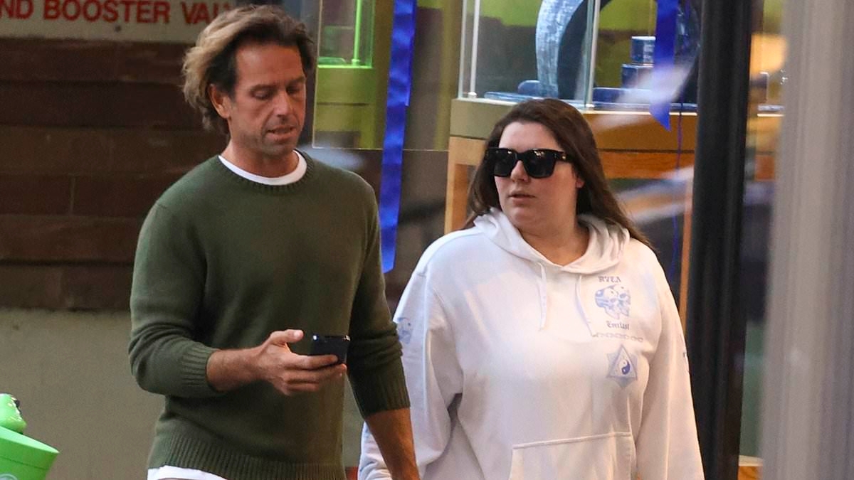Billionaire heiress Francesca Packer cuts a casual figure as she strolls hand-in-hand with rarely seen boyfriend Robert Bates in Sydney