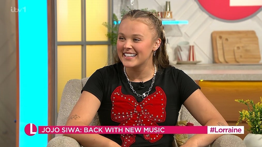 Jojo Siwa stuns Andi Peters as she reveals truth about relationship with Chris Hughes live on Lorraine - after his VERY romantic gesture at airport