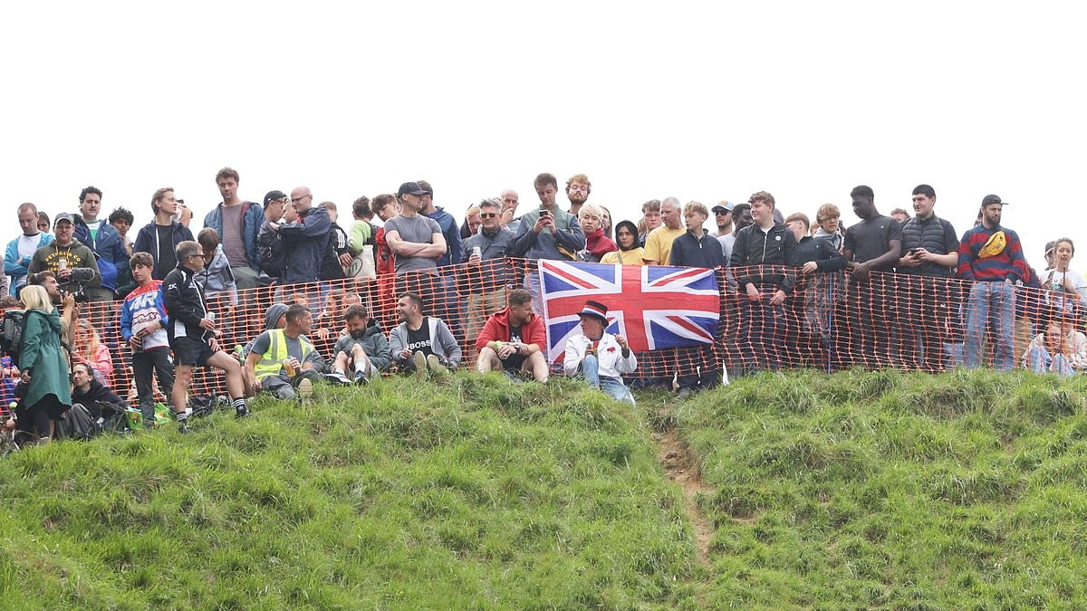 Daredevils hurl themselves down Cooper's Hill as Gloucestershire's famous Cheese Rolling race returns