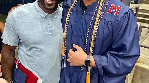Massive Super Bowl champion is dwarfed by his son in surprising high school graduation photo