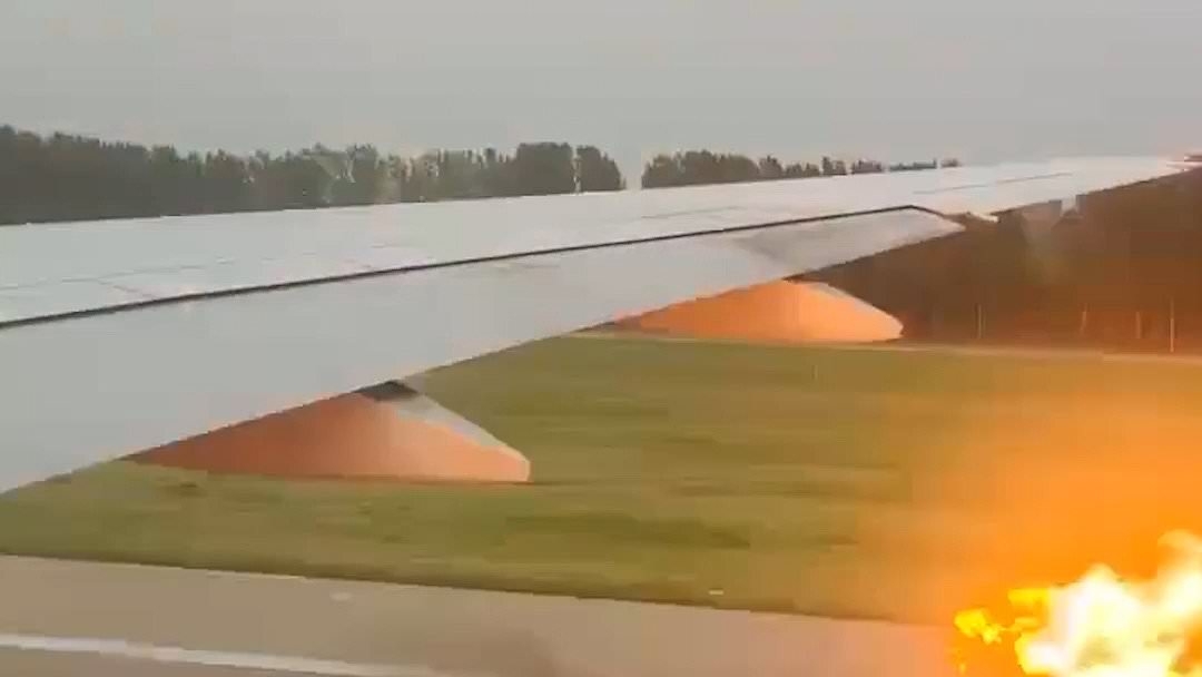Terrifying moment engine bursts into flames on United Airlines passenger jet taking off for US from China - forcing flight to be abandoned