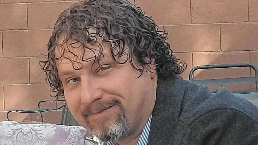 Mystery as journalist is found murdered and stuffed in a box after warehouse employee noticed 'foul smell'