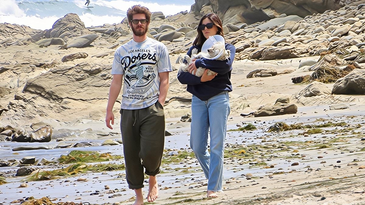 Andrew Garfield and Monica Barbaro enjoy a romantic walk on the beach in Malibu