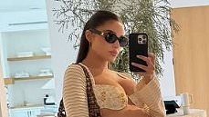 Pregnant Olivia Culpo shows off her growing baby bump in a chic floral bikini as she shares common pregnancy struggle in new video