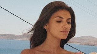Samie Elishi sets pulses racing as she poses in a skimpy lilac bandeau bikini while eating ice cream after steamy kiss with Sam Thompson