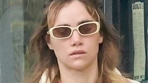 Suki Waterhouse cuts a low-key figure in a yellow cropped jumper and tracksuit bottoms as she stepped out in Los Angeles