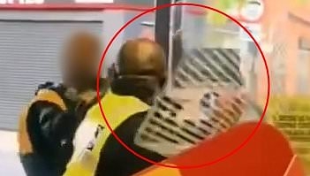 Moment Iceland security guard arms himself with a shopping basket to ward off thief aiming kicks at him