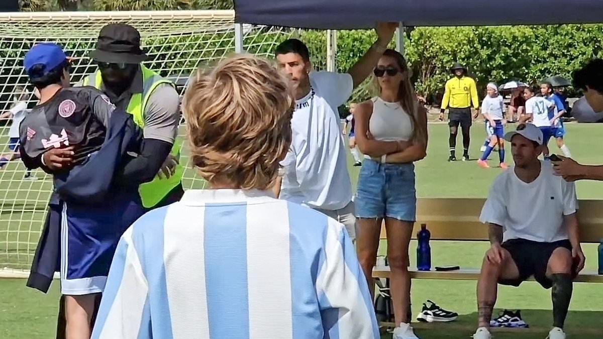 Shocking moment crazed fan runs at Lionel Messi and Luis Suarez before he gets dragged away by security