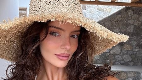 Maura Higgins displays her jaw-dropping figure in a white bikini as she enjoys boozy lunch during lavish sun-soaked getaway